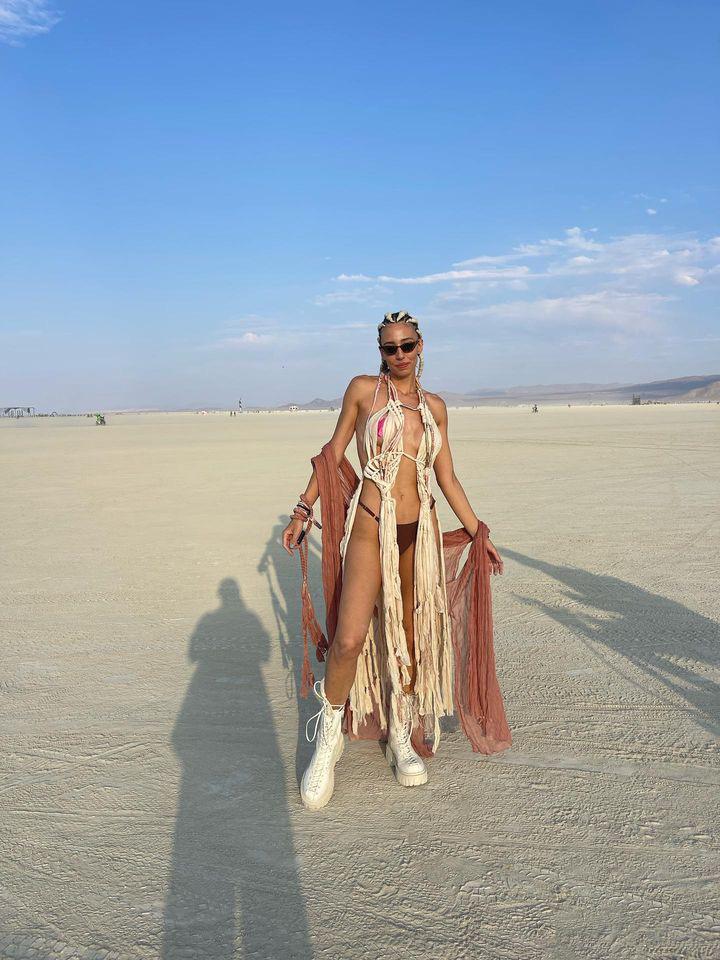 Vista Collective burner in hand-knotted fringe cape on the playa