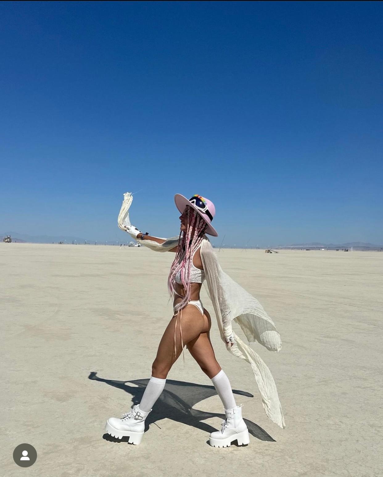 Playa look with hand-shaped hat and flowing silk from Vista Collective