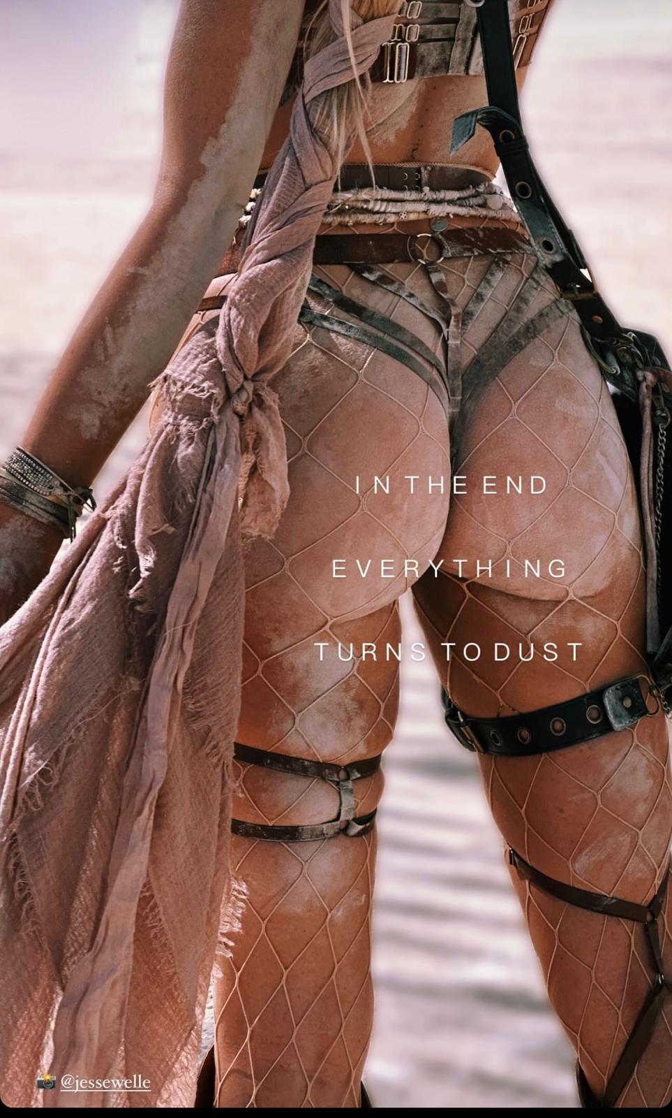Dust-covered mesh and leather harness detail — Burning Man styling